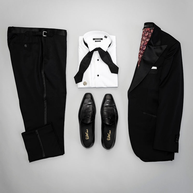 black leather boots on white surface