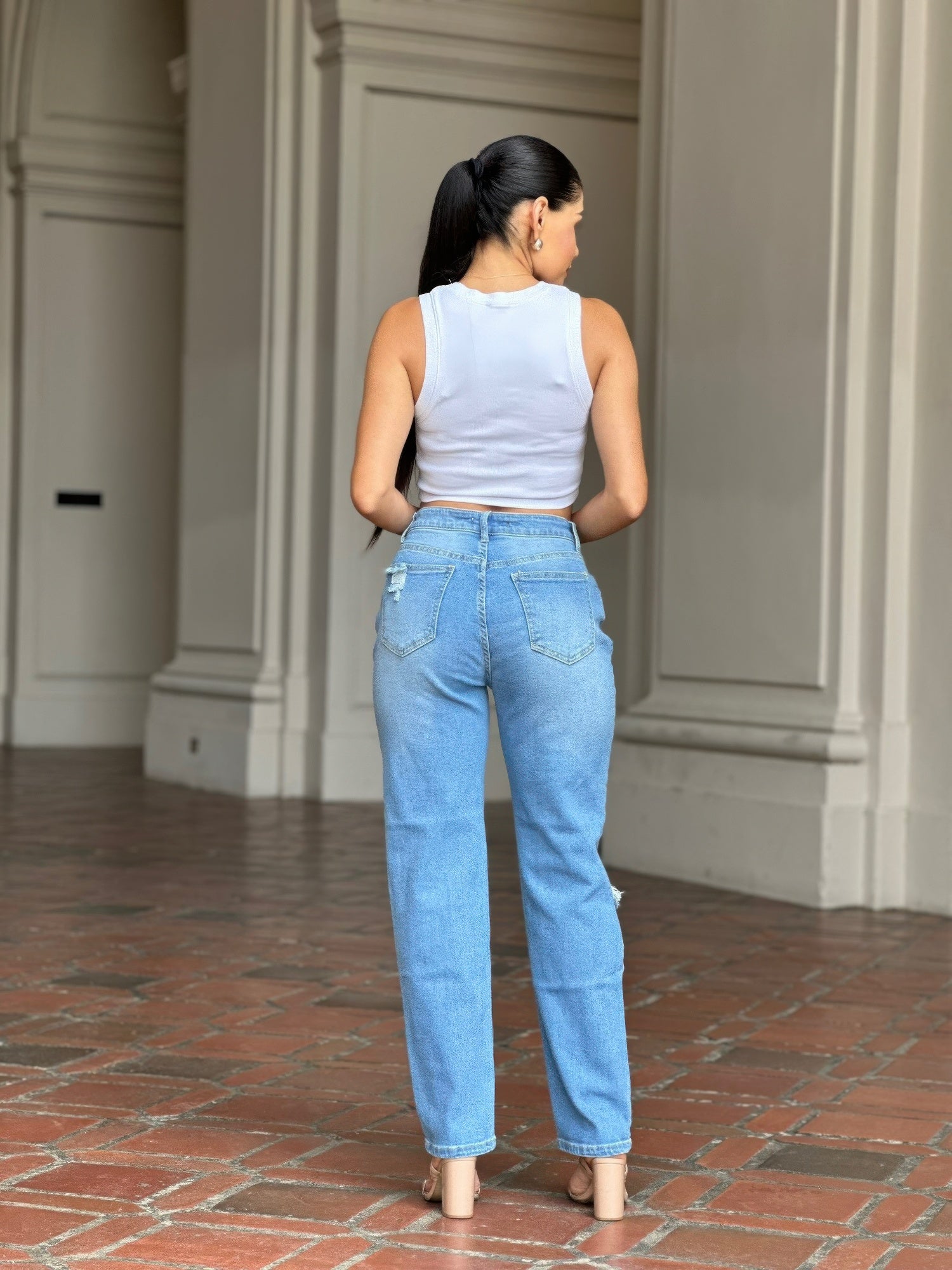 Medium Wash High Rise Jeans With Distress And Rips         
