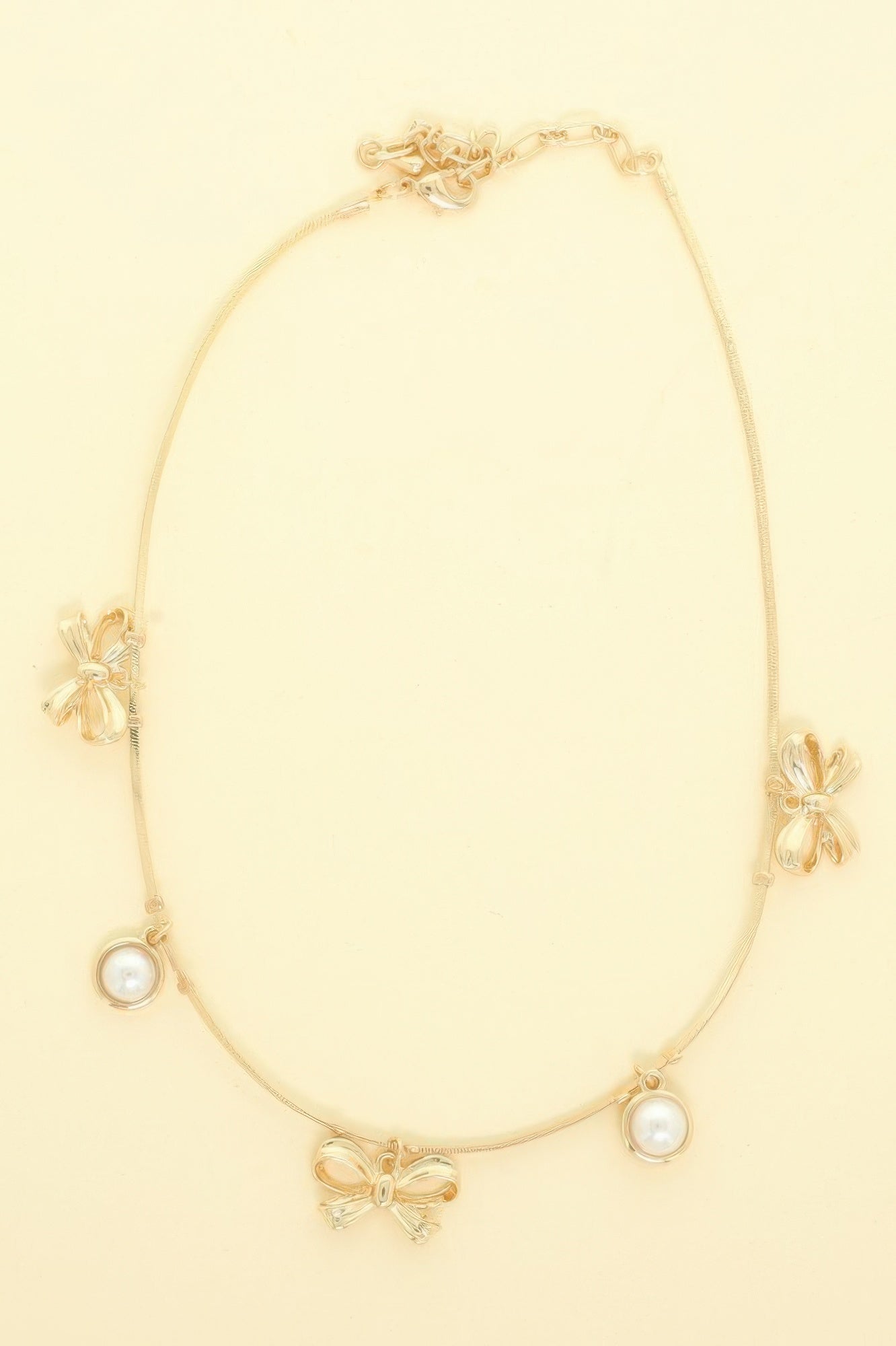 Bow Themed Pearl Charm Necklace