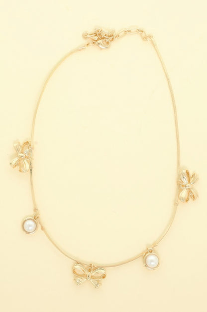 Bow Themed Pearl Charm Necklace