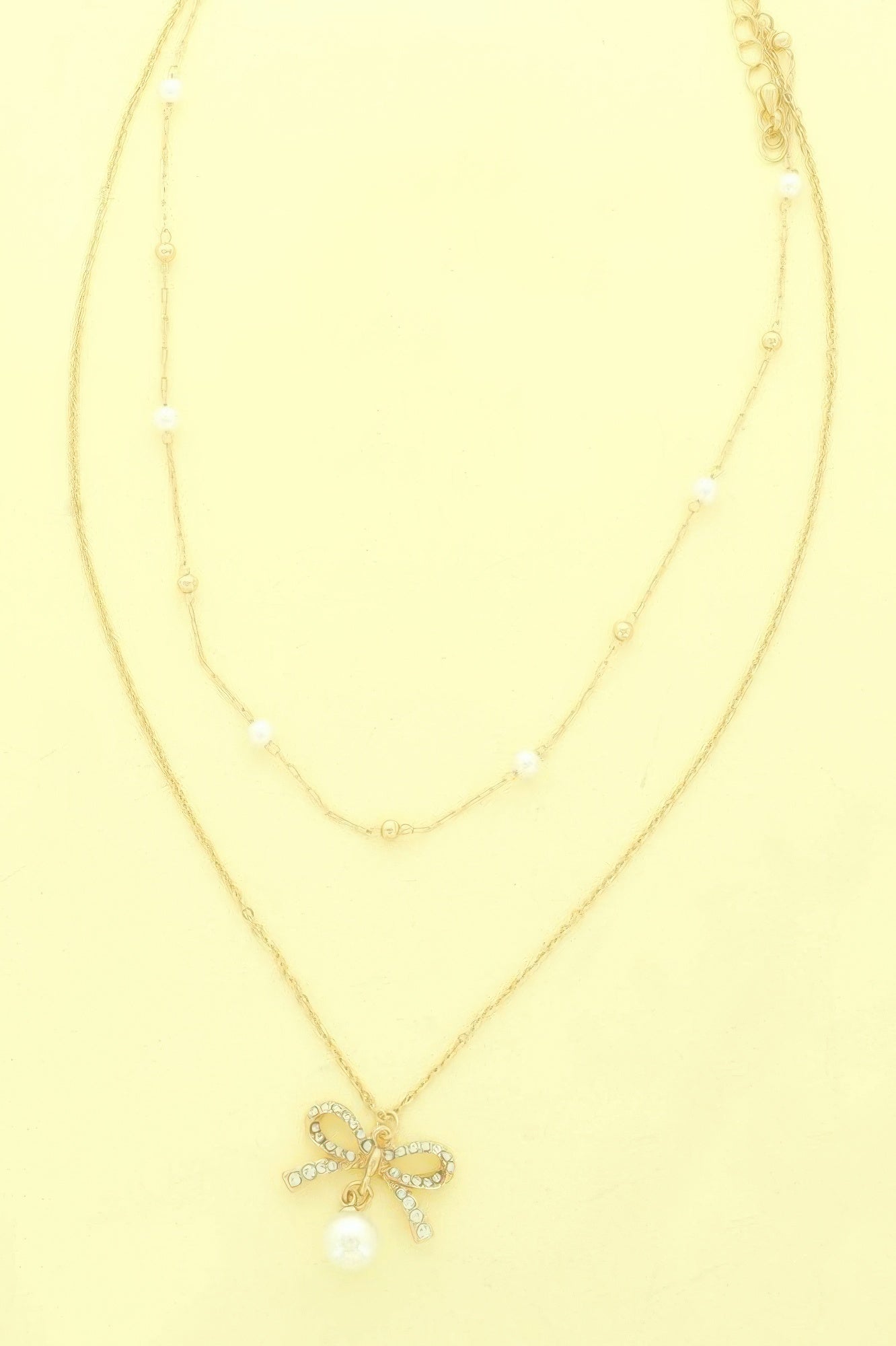 Dual-strand Jewled Bow Pendant Necklace