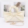 Nylon Top-Handle Clutch with Bow Front Accent