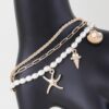 At The Beach Multi Charm Bracelet – Gold Finish with Cream Charms