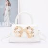 Faux Leather Top Handle Bag with Metal Ribbon Accent