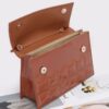 Embossed Enamel Top Handle Bag with Mixed Metal Accents