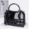 Embossed Enamel Top Handle Bag with Mixed Metal Accents