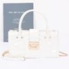 Embossed Enamel Handle Clutch – Structured Faux Leather