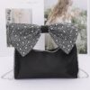 Rhinestone Bow Handle Nylon Clutch – Satin Finish