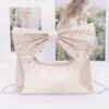 Rhinestone Bow Handle Nylon Clutch – Satin Finish