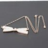 Faux Pearl Bow Necklace – Polished Bow Accent
