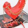 Heart-Shaped Clutch with Oversized Handle
