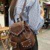 Vegan Leather Backpack - Curved Flap & Metal Eyelets